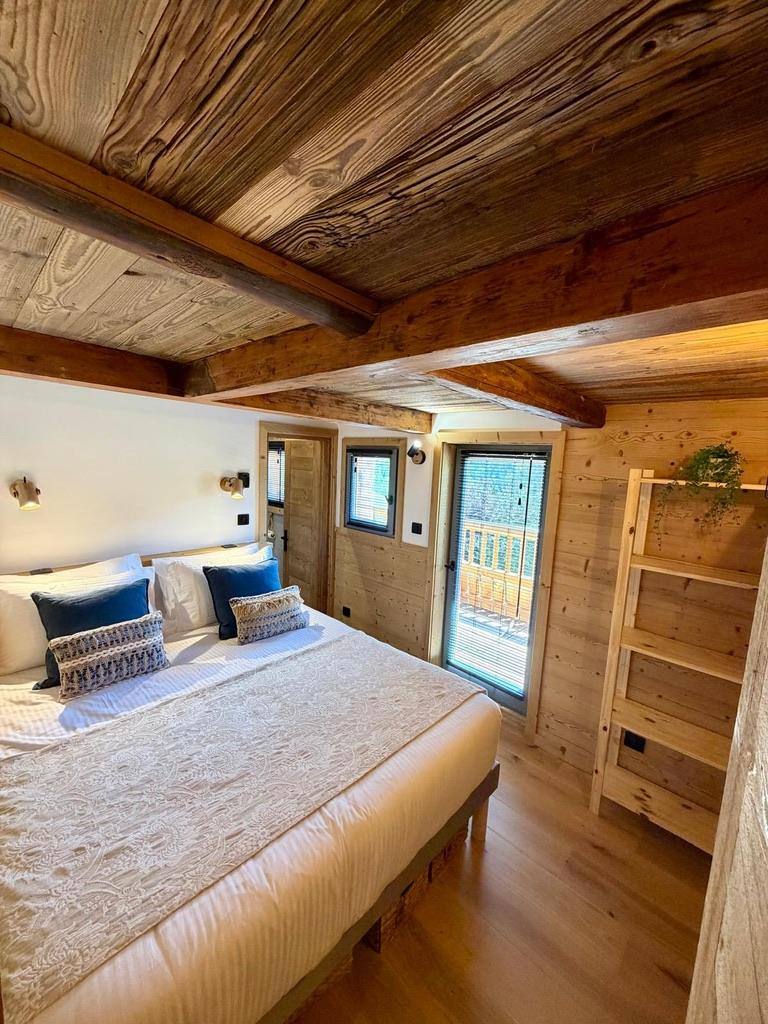 Bedroom with reclaimed-wood ceiling